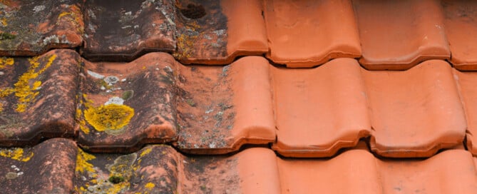 Close up of roof shingles with half pressured clean